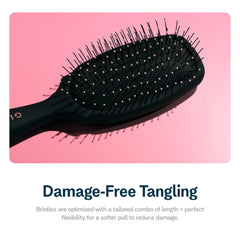GIMME Beauty Detangling Brush velvet-grip handle closeup for comfortable styling sessions.