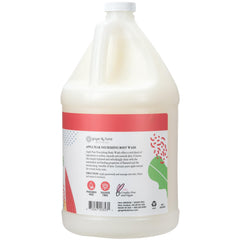 Ginger Lily Farms pouring refill into dispenser for economical and waste-saving refill