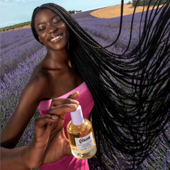 Gisou hair being spritzed for on the go refresh and fragrance