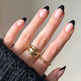 Glamnetic Caviar semi-transparent base nails with jet black tips for versatile styling.