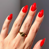 Glamnetic Fiery Red short almond nails with glossy finish for everyday wear.
