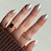 Glamnetic Hailey nails in glossy semi-transparent almond for chic day-to-night wear.