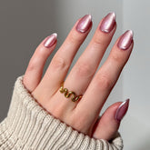 Glamnetic Mertini pink cat-eye nails deliver salon-style shimmer for chic summer looks.