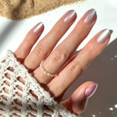 Glamnetic Oyster nails with pearlescent velvet finish for a light-catching, photo-ready shimmer.