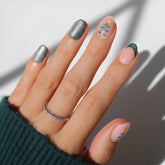 Glamnetic Velvet Pine press-on nails with French tips and tree designs for festive styling