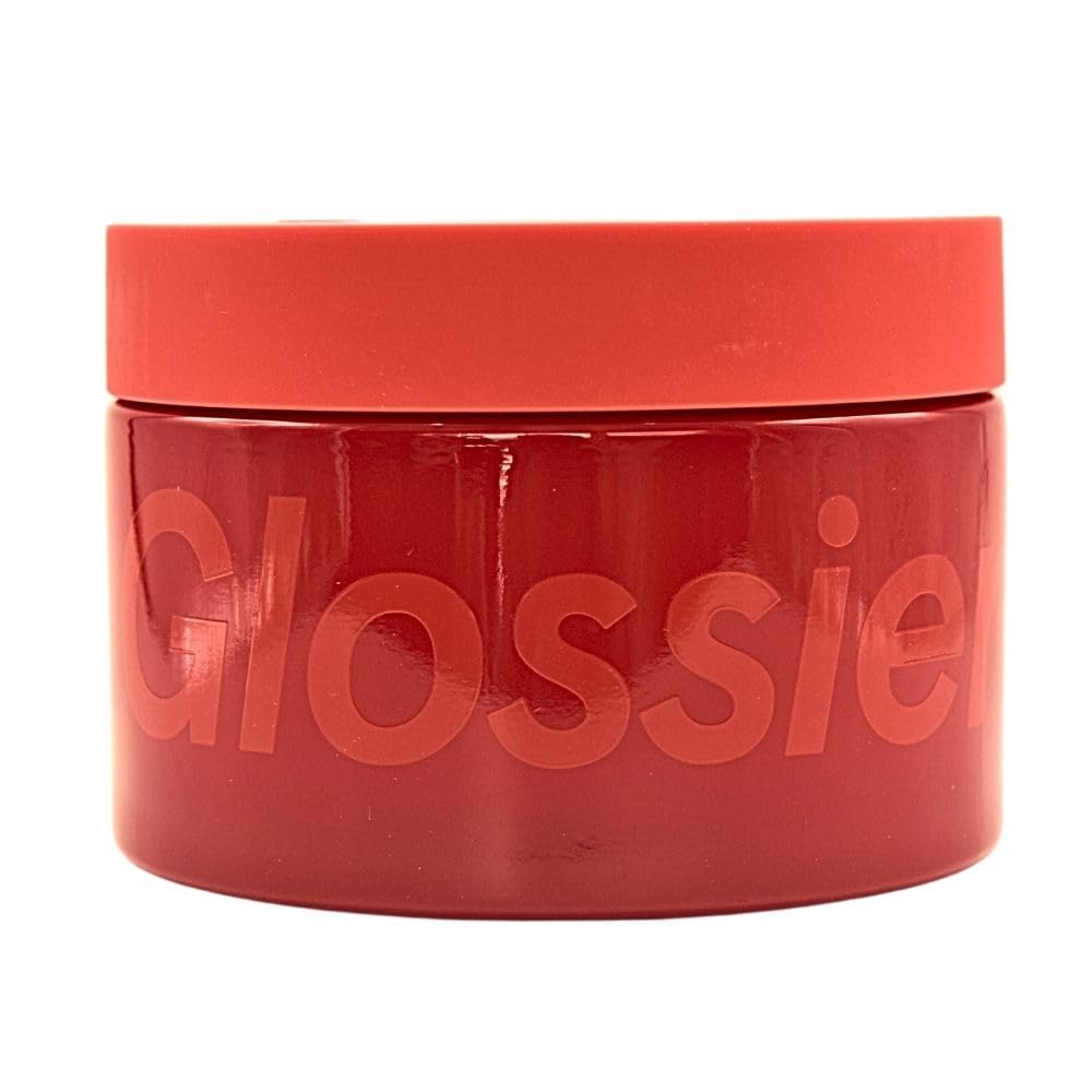 Glossier Creme de You body butter tub closeup showing rich, fast-absorbing texture.