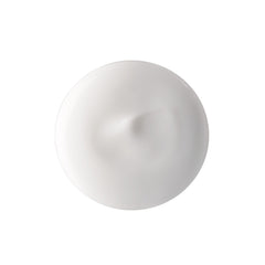 Close-up of Hydramucine cleansing milk texture showing creamy emulsion