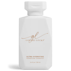 Goldie Locks travel-size shampoo bottle pours, highlighting portable hydration for color-treated hair.
