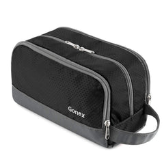 Gonex travel toiletry bag nylon black main compartment keeps bottles organized.