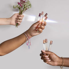 Queen Bee Travel Spray on wrist applying from Good Chemistry for on-the-go refresh