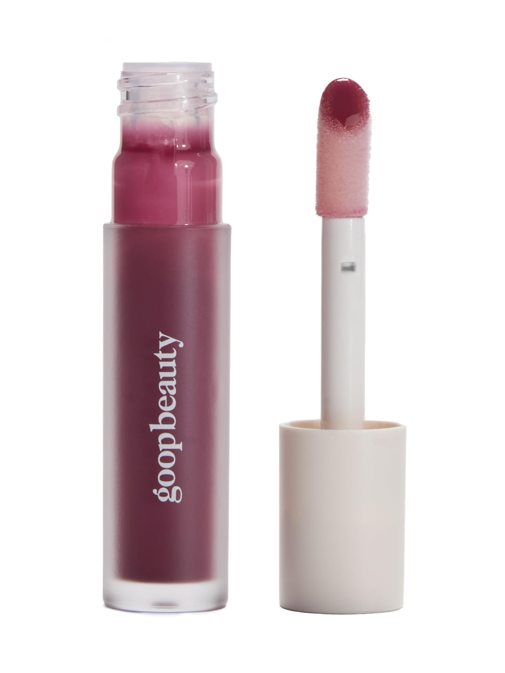 Goop Beauty Hydra-Barrier Gel Gloss tube closeup shows lilac shade for hydrated lips.