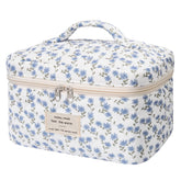Gosect large makeup bag front view with blue peacock floral pattern for travel organization
