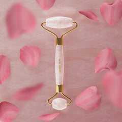 Grace & Stella Rose Quartz Roller in hand during cheek massage.