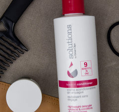 GREAT CLIPS Solutions leave-in conditioner spray dispenses evenly for easy detangling.
