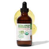 Green Virgin Products Organic Moringa Oil bottle with dropper for precise, mess-free application.
