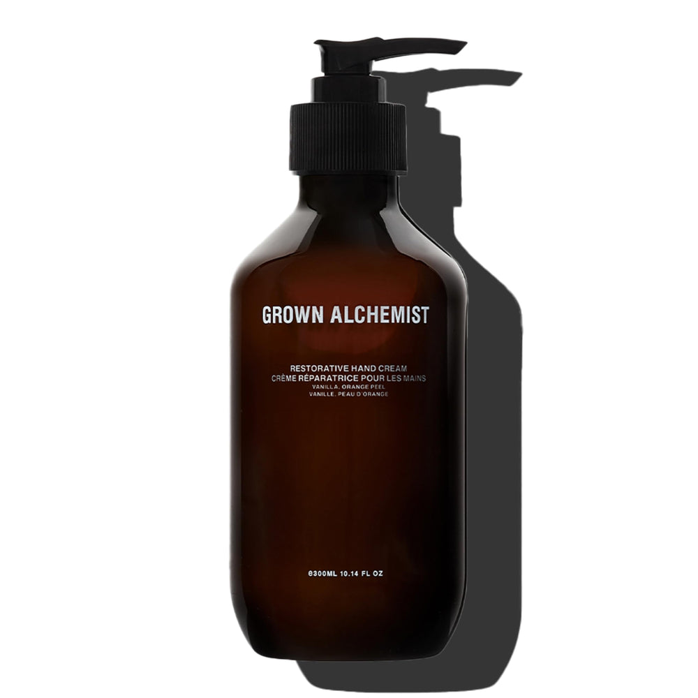 Grown Alchemist Restorative Hand Cream bottle close-up shows vanilla-orange peel scent and nourishing oils.