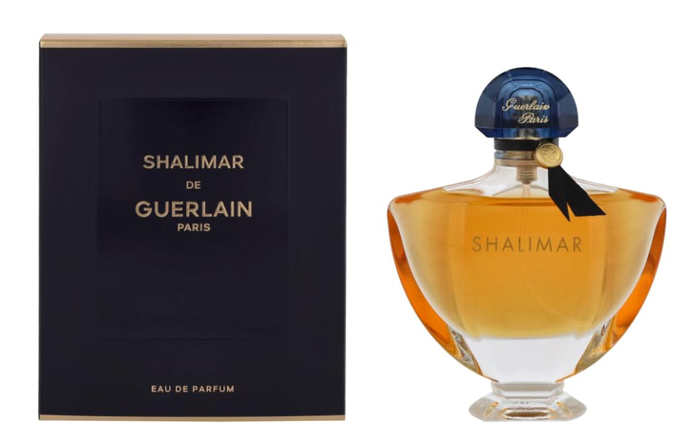 Guerlain Shalimar bottle with sapphire stopper—timeless luxury for evening elegance.