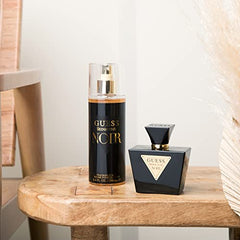 Guess Seductive Noir mist dispensing showcases easy-to-use fragrance highlight.