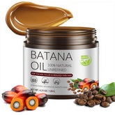 Gulizzmonis Batana Oil bottle close-up, premium cold-pressed formula for hair nourishment