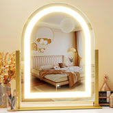 Gvnkvn arched makeup mirror front view in gold with bright even lighting for makeup.