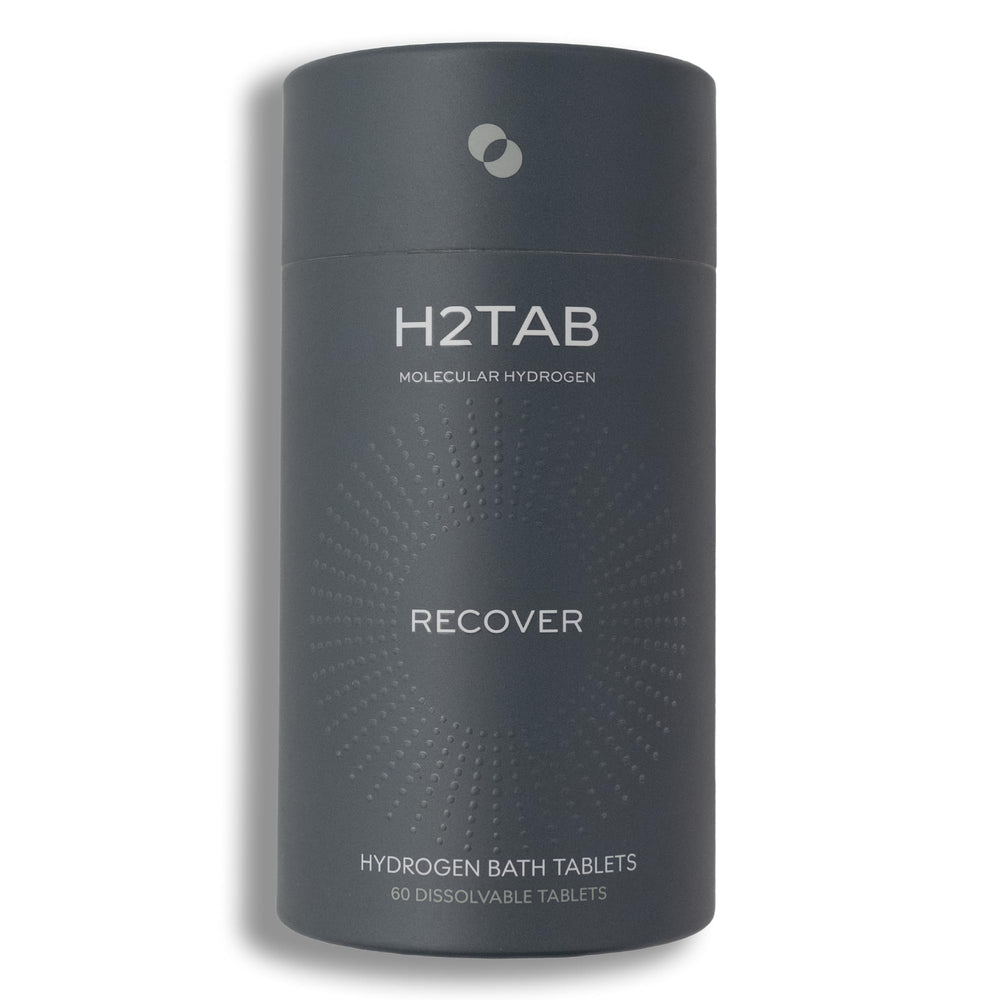 H2TAB hydrogen bath tablet dissolving in water for deep full-body recovery.