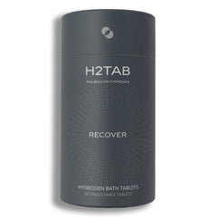 H2TAB hydrogen bath tablet dissolving in water for deep full-body recovery.