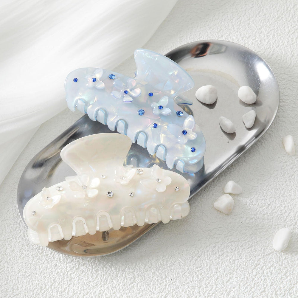 HAIMEIKANG acrylic flower hair clip close-up shows translucent color and secure grip.