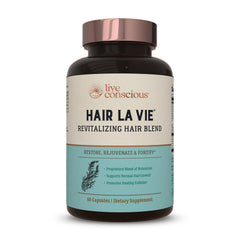 Hair La Vie Revitalizing Blend bottle front for daily hair health support.