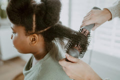 Hairitage Volumizer Brush with two heat speeds and cool option for versatile styling.