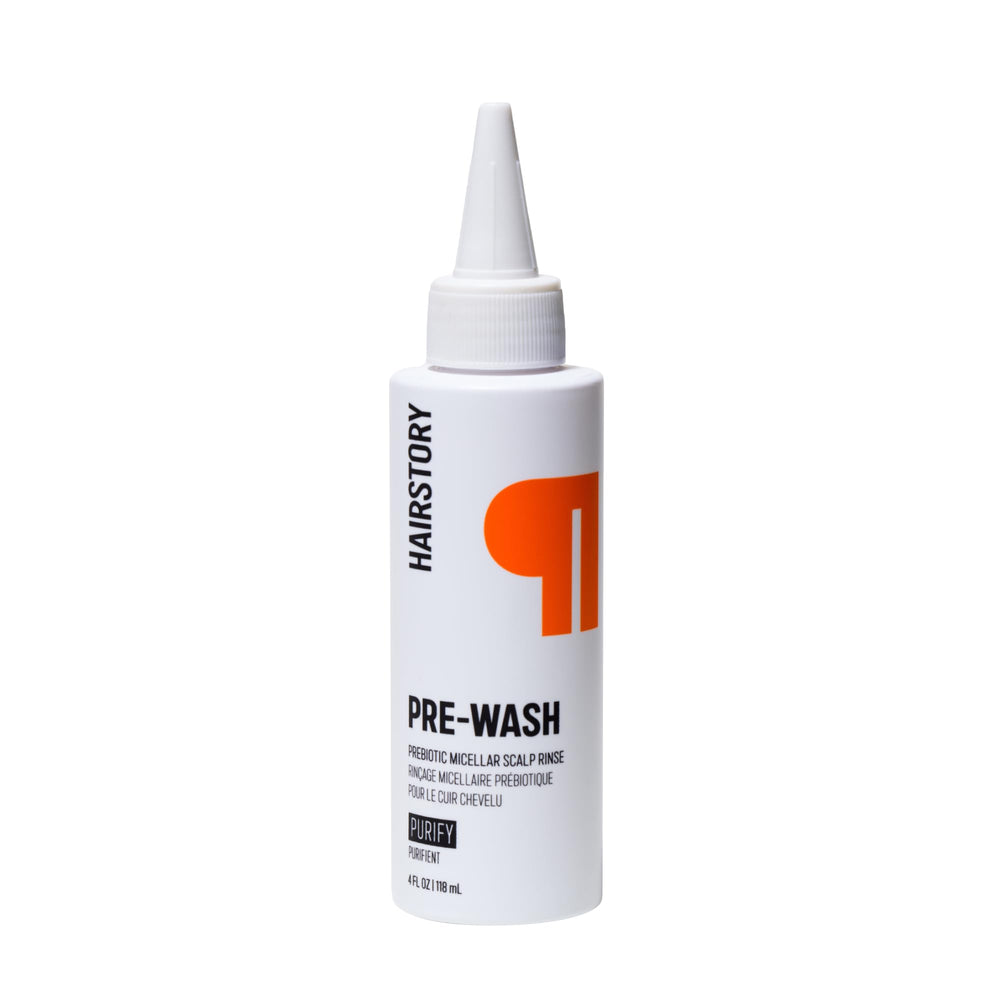 Hairstory Pre-Wash bottle pour demonstrates a gentle buildup-removing cleanse