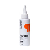 Hairstory Pre-Wash bottle pour demonstrates a gentle buildup-removing cleanse