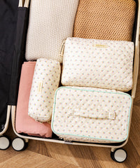 HBselect makeup bag large capacity front view holding cosmetics and brushes.