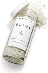 HERBIVORE Detox Soaking Salts in a warm bath creating aromatherapy and relaxation.