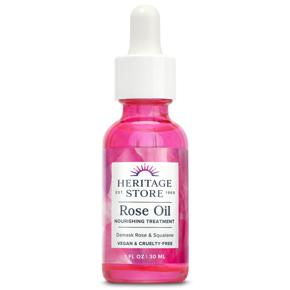 HERITAGE STORE Rose Oil bottle closeup shows hydrating moisture for glowing skin.