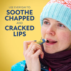 Herpecin L lip balm stick closeup showing smooth glide and hydration.