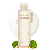 HEVEBLUE Salmon Caring Centella Toner bottle pours for balanced daily hydration.