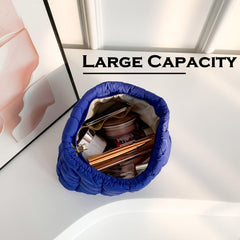 HFLZBRO Puffy quilted makeup bag blue interior fits cosmetics and brushes.