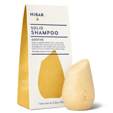 HIBAR Soothe Shampoo Bar on wet hair for easy application and gentle cleansing.