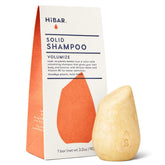 HIBAR Volumize bar on stand shows plastic-free packaging and travel-friendly design