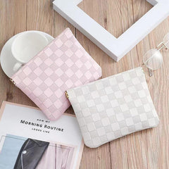 HIGH FIT leather pocket cosmetic bag with no-zip design enables one-handed access for quick touch-ups