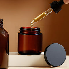 Hoa Kinh jars with black lids demonstrating airtight seal for salves and oils.