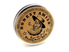 Honest Amish Extra Grit Beard Wax hands applying near chin for precise styling and hold.