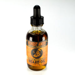 Honest Amish Premium Beard Oil 2oz pour demonstrates easy dropper application for grooming.