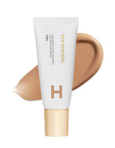 Hourglass Veil Hydrating Skin Tint bottle shows dewy glow with lightweight coverage.
