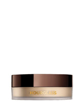 Hourglass Veil translucent setting powder jar close-up for mess-free, precise application.