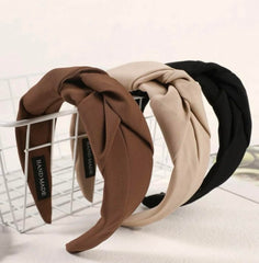 Huachi knotted headbands black on head for secure non-slip wear.
