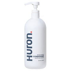 Huron Men’s Conditioner bottle-front showing lightweight hydration and frizz control.
