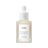 Huxley Secret of Sahara Oil Essence bottle closeup for lightweight hydration.