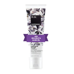 IGK Expensive gloss bottle closeup showing clear, weightless shine for color-rich strands