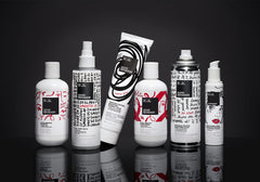 IGK Good Behavior frizz-barrier close-up depicts protective shield for frizz-free styling.
